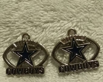 Set of 2 Dallas Cowboys charms.