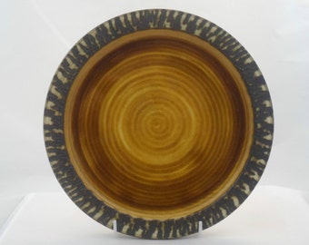 Brown plate with textured rim by Tony Bristow. Manufactred at Bristow Pottery Chillington (post 1974).