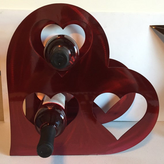 Items similar to Heart wine bottle holder on Etsy