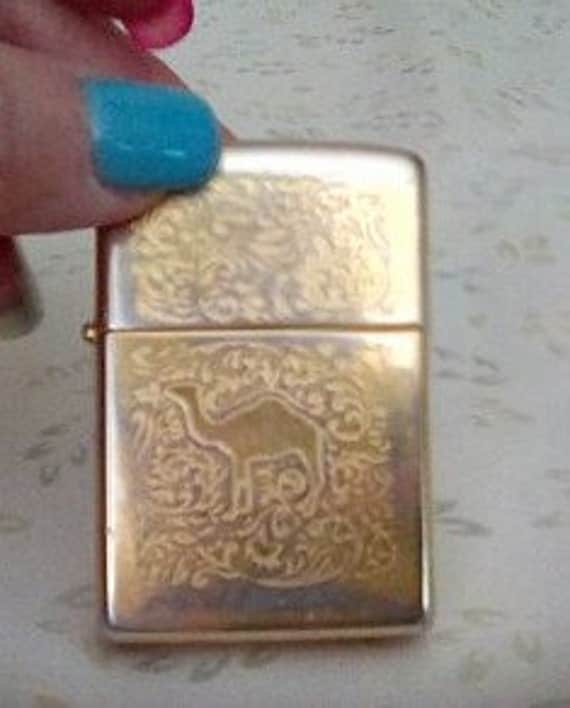 Vintage Camel Zippo Lighter gold tone designed with a Camel on
