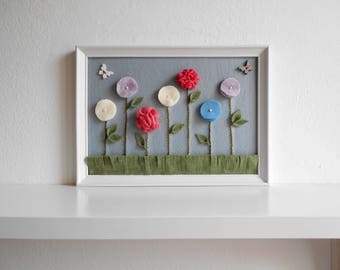 Nursery decor with fabric flowers and wooden butterflies