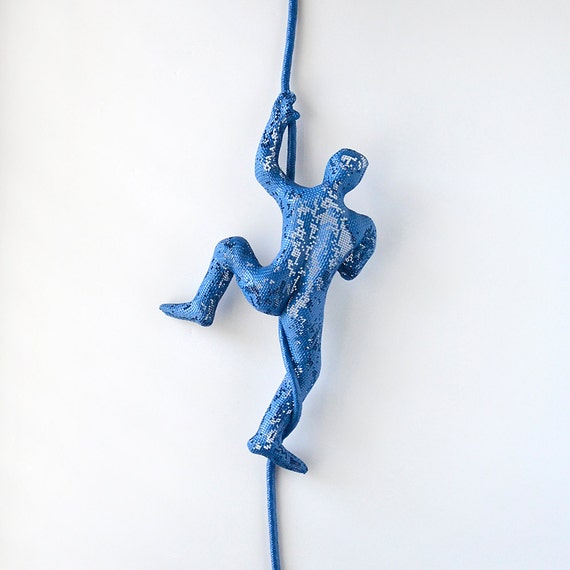Climbing man on rope Metal art sculpture Contemporary wall