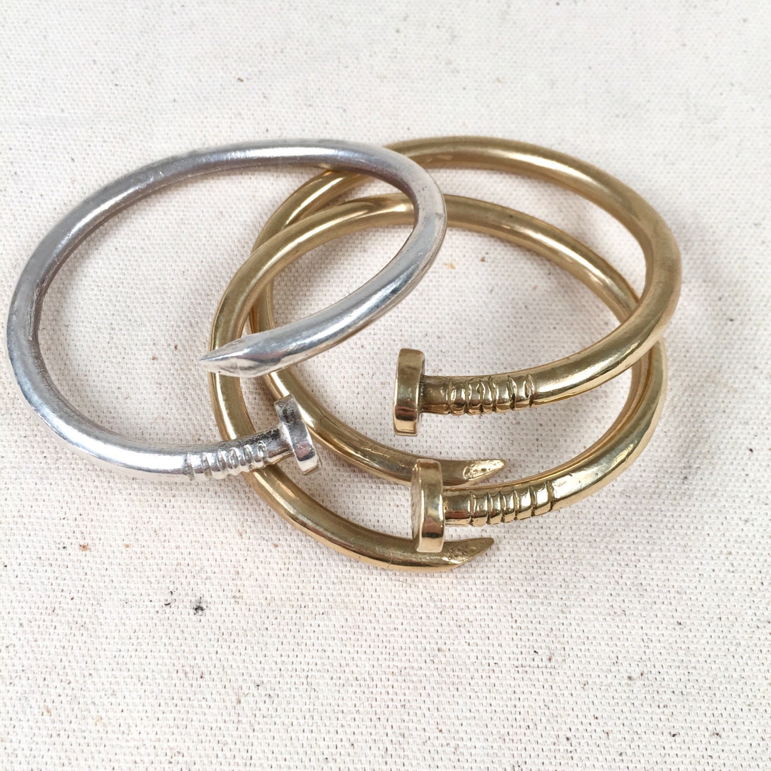 Nail bangle in silver or bronze