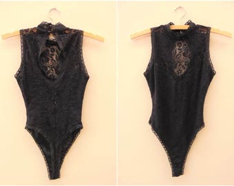 Black long sleeve lace insert high leg cupped body designs wear vector