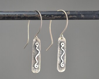 Sterling silver squiggle earrings.