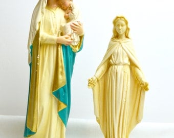 pair of religeous statues of madonna and child
