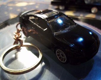 custom made keychain,2010 infiniti g37 coupe,flat black w/black tires on silver mags/repaint mint