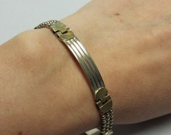 Slinky bracelet gold silver and black bracelet beaded