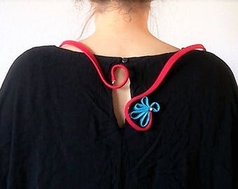 Collar 3. Metallic collar lined in red with ornament in turquoise and metal beads.