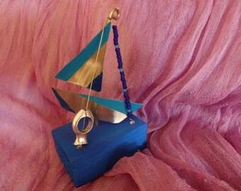Boat miniatures made of alpaca and copper etched with shapes