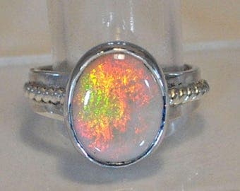 Sterling silver ring with opal setting