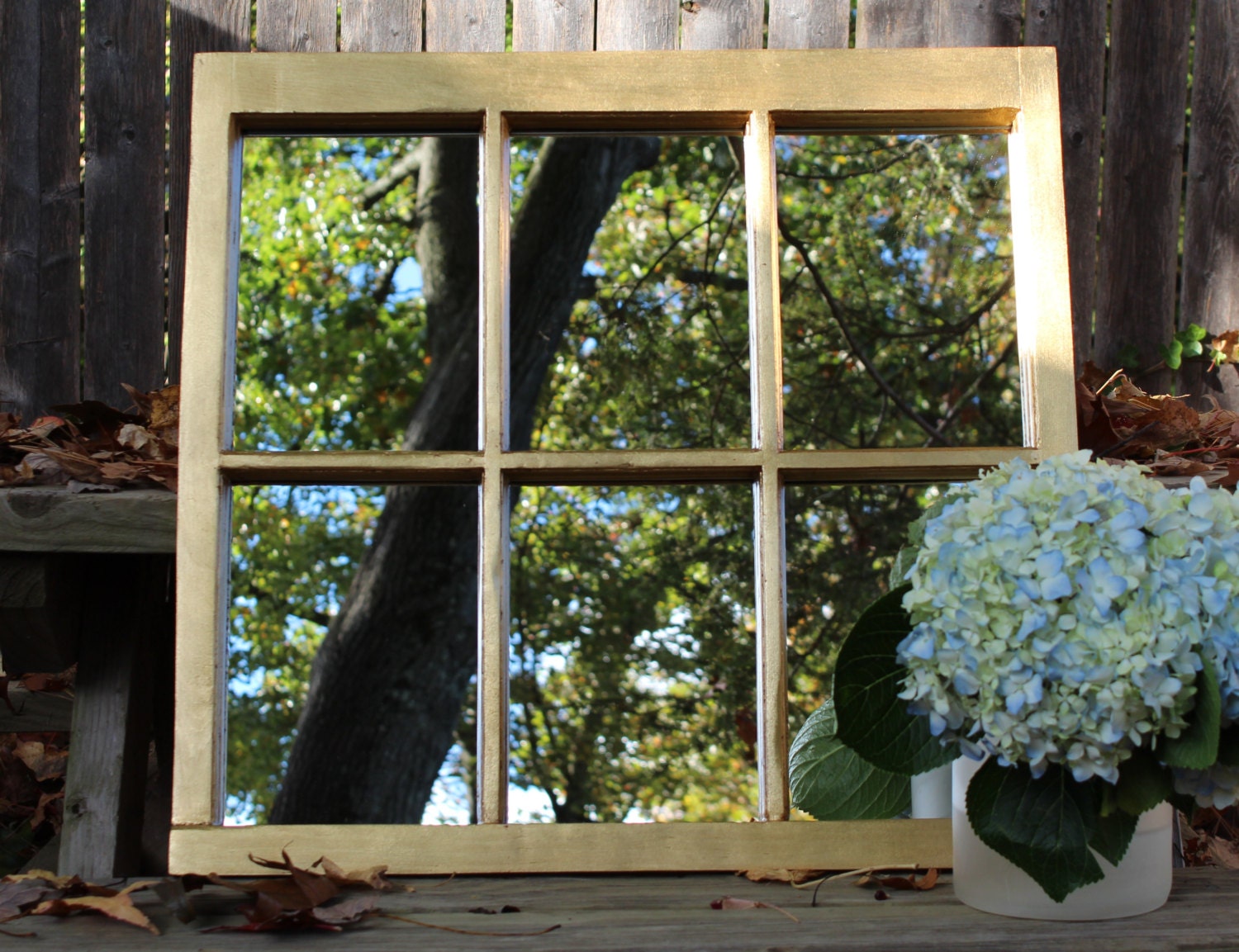 Warm gilded gold window frame framed mirror