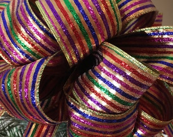 Lg Christmas Tree topper bow made of a multi colored striped ribbon 8 ft. tails