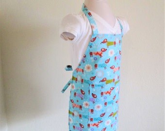 Childrens Apron - A sweet Kids Apron covered with dogs..hot dog dogs...on a vibrant sky blue, a great cooking or arts and crafts apron