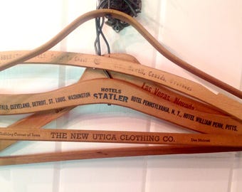 4 vintage wood hangers Advertising printed on one side Sahara Hotel New Utica Clothing Company Hotels Statler Sheraton hotel