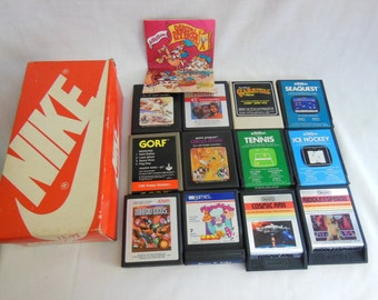 12 Vintage Atari Games w/vintage NIKE Shoe Box & 1983 Dentist Activision Advertisemnet offers considered