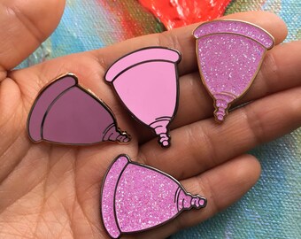 1.25" Menstrual Cup Lapel Pin in pink, glitter, gold and black nickel