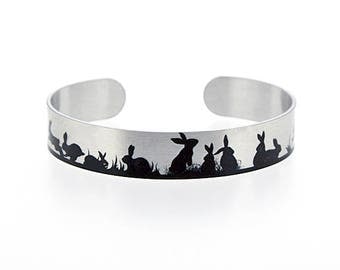 Rabbit jewellery, brushed silver cuff bracelet, metal bangle with bunnies in black. Animal lover bunny rabbit gifts. S502