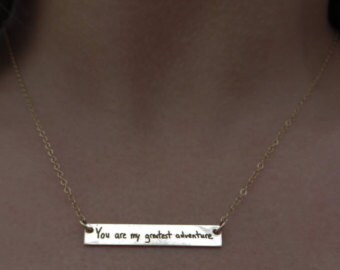 We wish we had a picture of her actual necklace, but this is the listing she choose from.