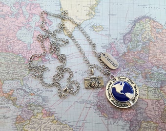 Travel Necklace "Never Stop Wandering" Pendant Swivels to Other Continents, Camera, "Journey" Tag on 33" Silver Link Chain & Lobster Clasp.