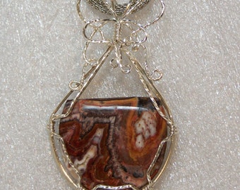 Natural Petrified Wood Pendant wire wrapped in a basket of sterling silver wire, fossil wood, brown black white tan petrified wood.