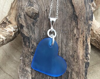 Hand Carved Rare cornflower Blue large Sea Glass Heart with sterling silver pendant.