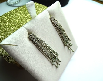 Clear prong set rhinestone waterfall earrings .Exceptional sparkle. Tiny clear rhinestones fall in a beautiful waterfall.