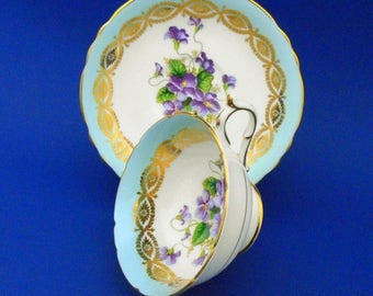 Paragon purple Violets art deco turquoise Tea cup and saucer glittering gold gilt