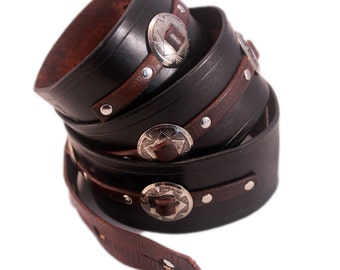 Black leather guitar strap with conchos