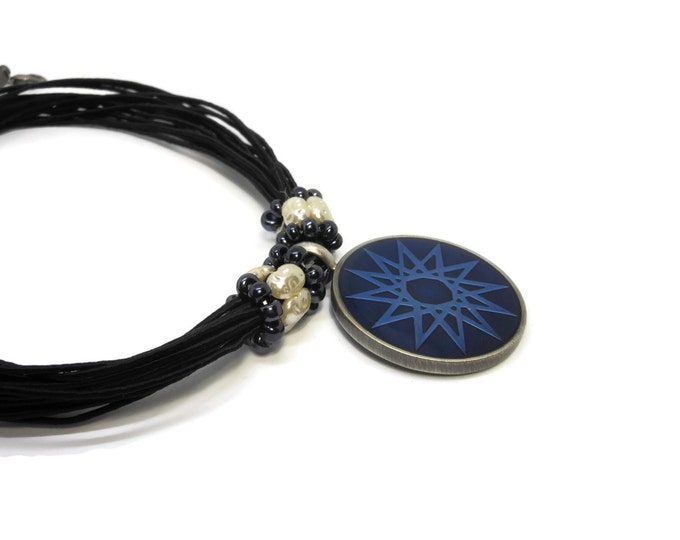 FREE SHIPPING Blue star pendant, round blue epoxy pewter pendant, faux translucent seed pearl ringlets, multi-strand black cord, star or sun