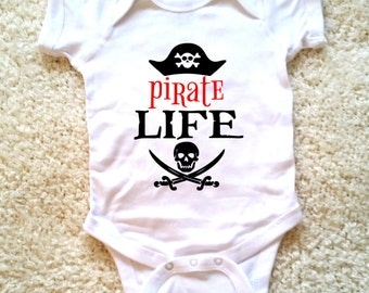 Pirate life graphic baby onesie, available in sizes newborn, 6 months, 12 months, 18 months graphic kid shirt