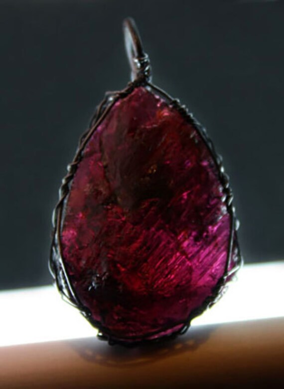 Garnet wrapped Celtic style with sterling silver