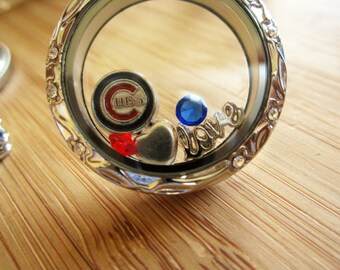 Go Cubs go! Steel floating locket with Chicago Cubs charms- show your team spirit. Stainless steel floating locket ring or necklace