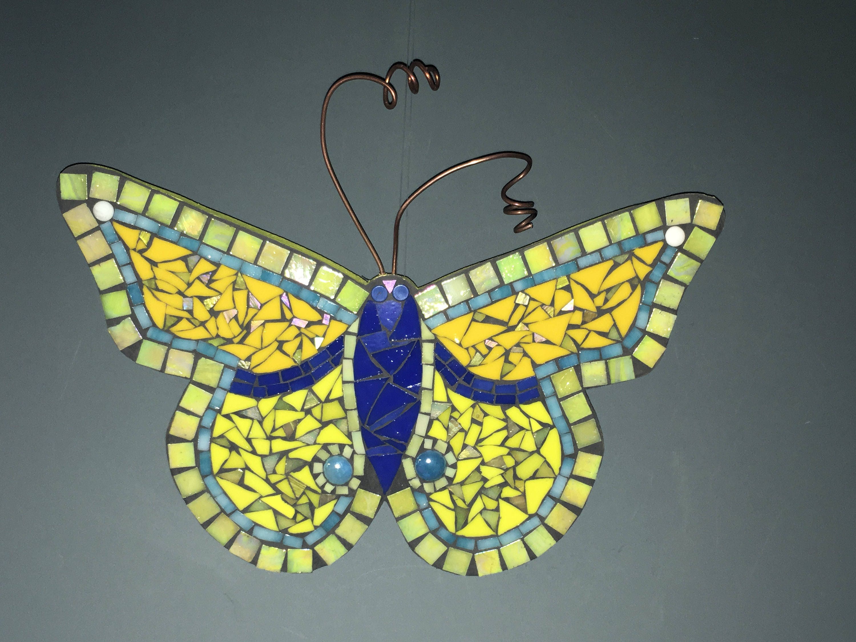 Mosaic butterfly made with stained glass in blue yellow and