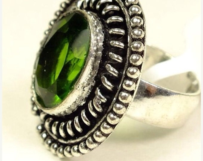 Storewide 25% Off SALE Beautiful Vintage Peridot cocktail ring Featuring multi-faceted peridot green center stone set in white metal