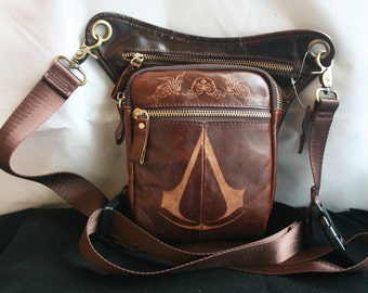 Assassin's Creed inspired Genuine Leather Leg Holster Bag, Hand engraved with the logo and the scroll and Gryphon design from Ezio's cloak