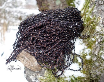 handspun 2ply of ravenblack mulberry silk and coppery Lurex