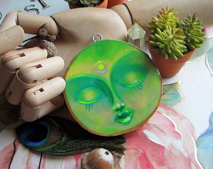 Green Moon Goddess with crescent. Wall hanging hand painted on a slice of birch wood. Comes with a rope hanger.