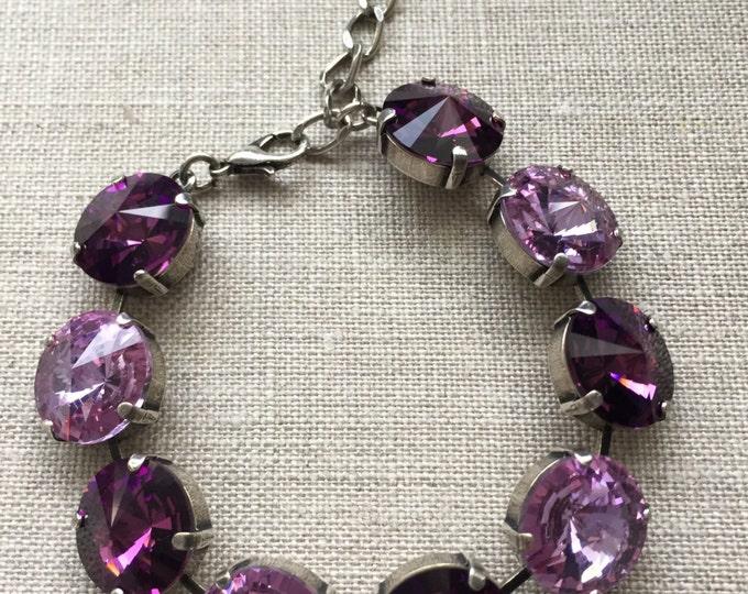 Powerfully sparkly light and dark purple amethyst Swarovski Crystal bracelet with 9 large 14mm rivoli stones. Bridesmaid wedding jewelry