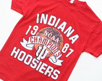 1980s Sportswear T -Shirt 80s Basketball Shirt 1987 Indiana Hoosier NCAA Basketball Champions Thin Fitted Graphic T Shirt Red Small
