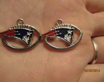 Set of 2 New England Patriots football charms.