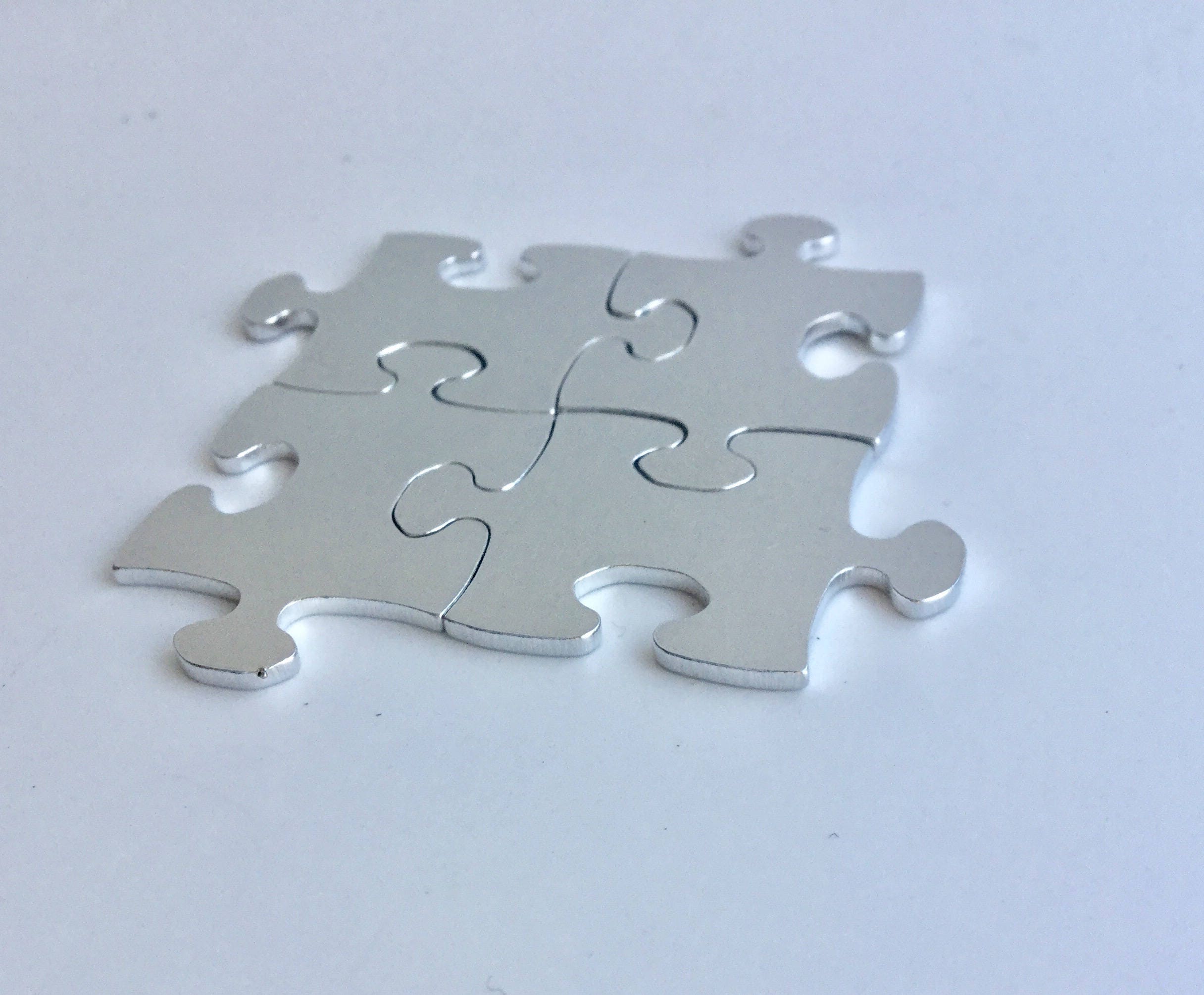 Interlocking Jigsaw Puzzle pieces 35x23mm aluminium 1.5mm thick from