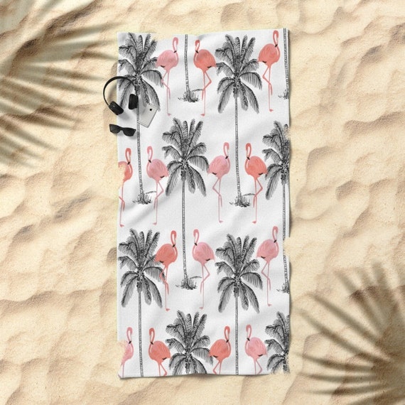 Flamingos and palm trees beach towel
