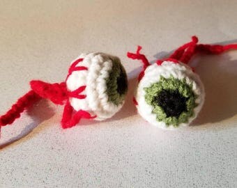 A pair of Crocheted Catnip Eyeball Toys