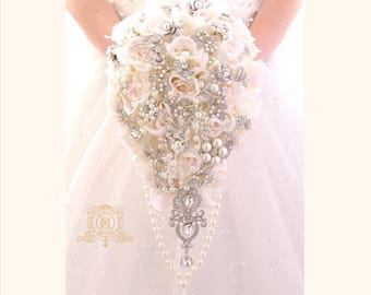 Off white, ivory, touch of pink BROOCH BOUQUET. Silver jeweled silk roses flowers teardrop cascading broach bouquet. Pearls bling wedding
