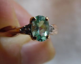 Natural Copper Bearing Paraiba Tourmaline ring. 7 x 5 mm weighing 1.05 ct. Set in 10 KT Rose Gold, size 9 US. In a Rosewood Box.