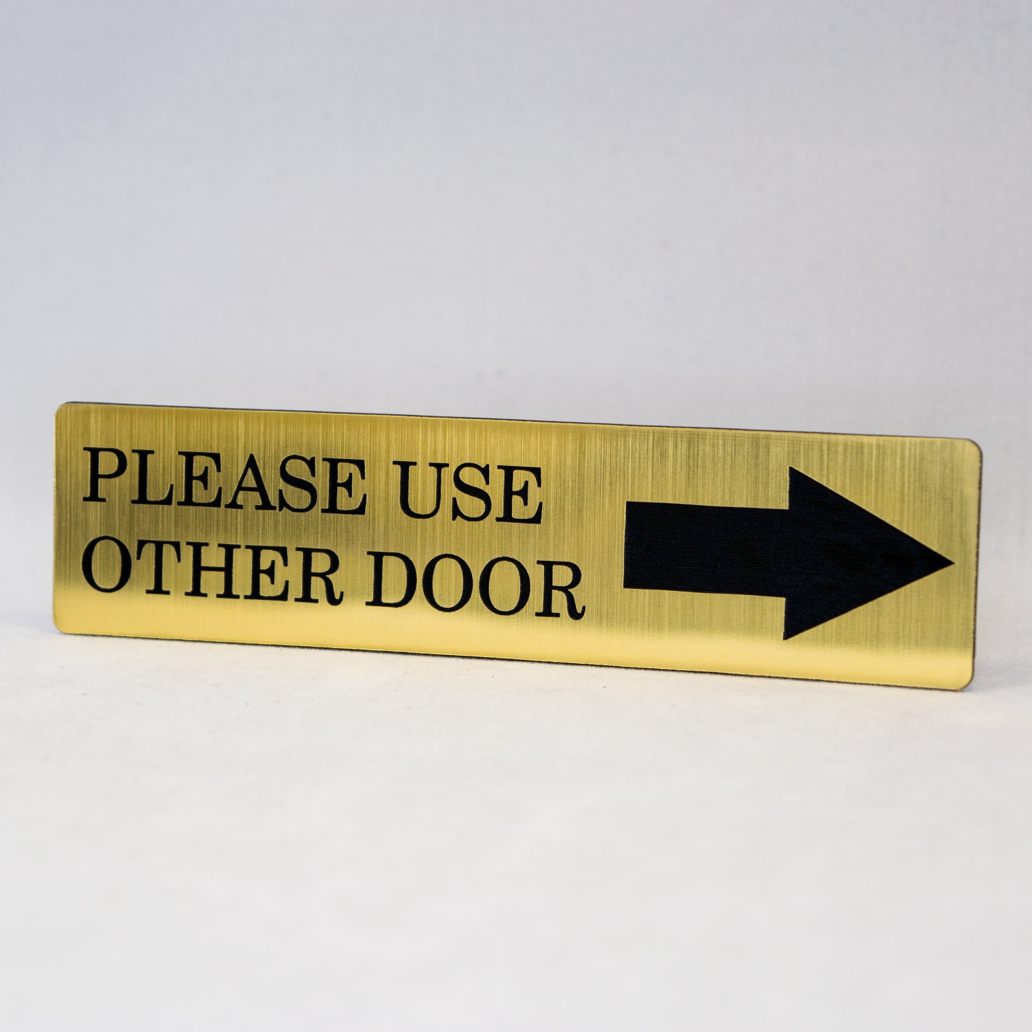 Please Use Other Door Engraved with Arrow Home Store or