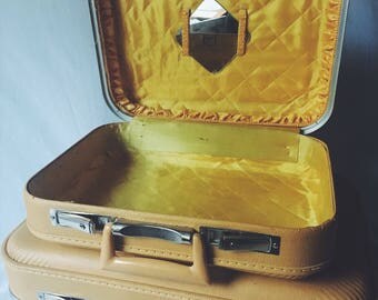 Yellow vintage suitcase set