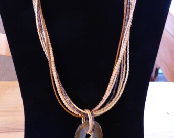 Seven strand torsade with Agate Geode pendant