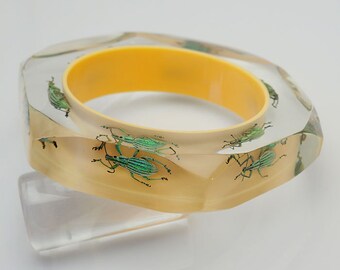 Yellow faceted lucite bracelet with six exotic real beetles